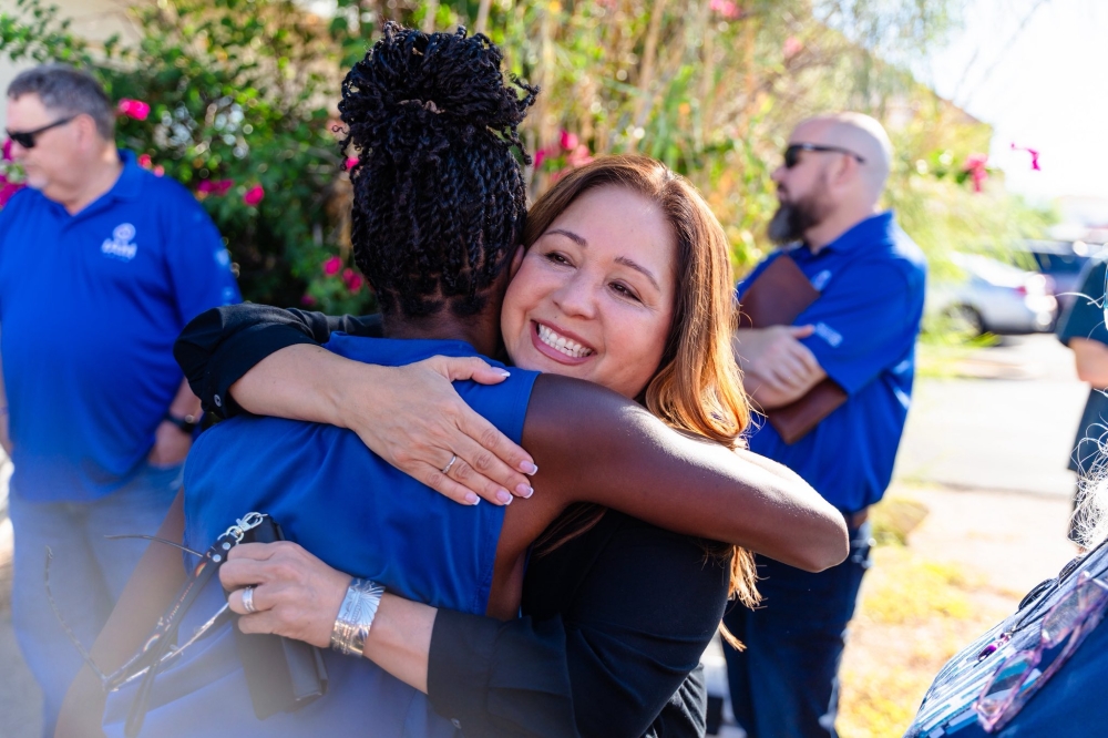 Adelita Grijalva is seen in a photo hugging a supporter. — Facebook poc