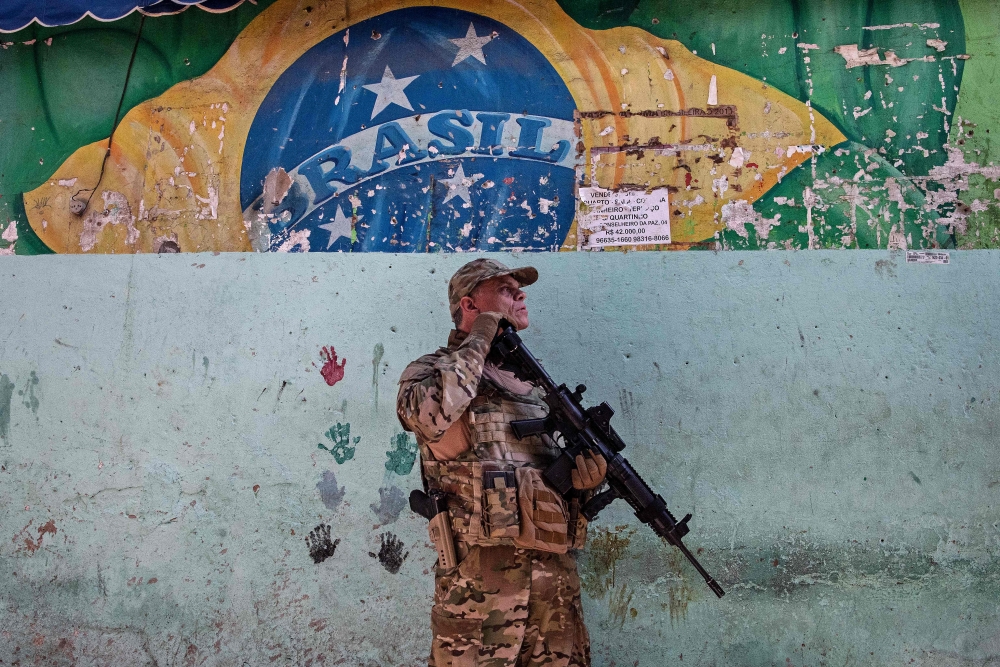 A member of CORE, a Special Operations wing of the Brazilian Civil Police, stands guard during a large scale operation against drug trafficking, to occupy and secure parts of Jacarezinho favela in Rio de Janeiro, Brazil, on January 19, 2022. On September 24, 2025, the Rio de Janeiro state legislature passed a law that would reward police officers who kill ‘criminals,’ sparking an outcry from human rights advocates. — AFP pic 