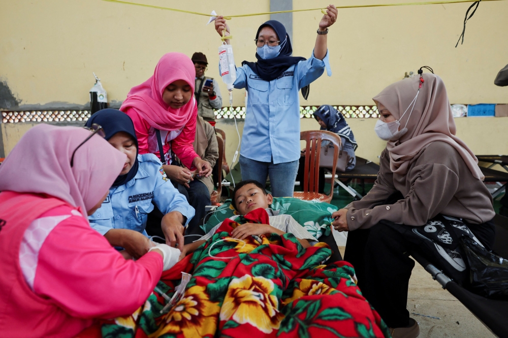 Muhammad Setiawan Pratama, 11, an elementary student receives treatment for food poisoning after eating government-sponsored free school meals, at a makeshift clinic inside a district’s hall in Bandung, West Java province, Indonesia, September 25, 2025. — Reuters pic 