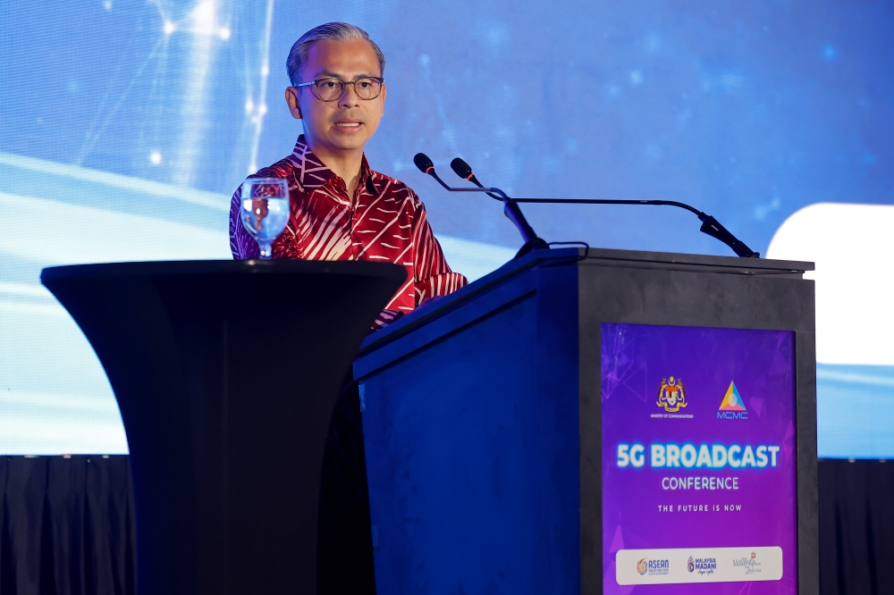 Communications Minister Datuk Fahmi Fadzil delivers his opening speech at the 5G Broadcast Conference, Putrajaya today. — Bernama pic