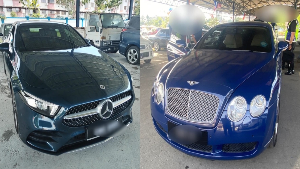 Two of the luxury vehicles seized by JPJ in Sabah. — The Borneo Post pic