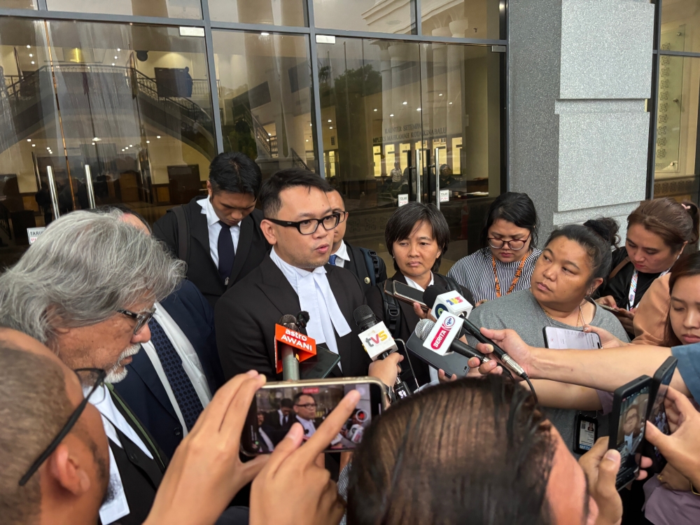 Lawyer Azhier Farhan Arisin (centre) also told reporters that the first two child witnesses told the court Zara Qairina had repeatedly expressed suicidal thoughts.