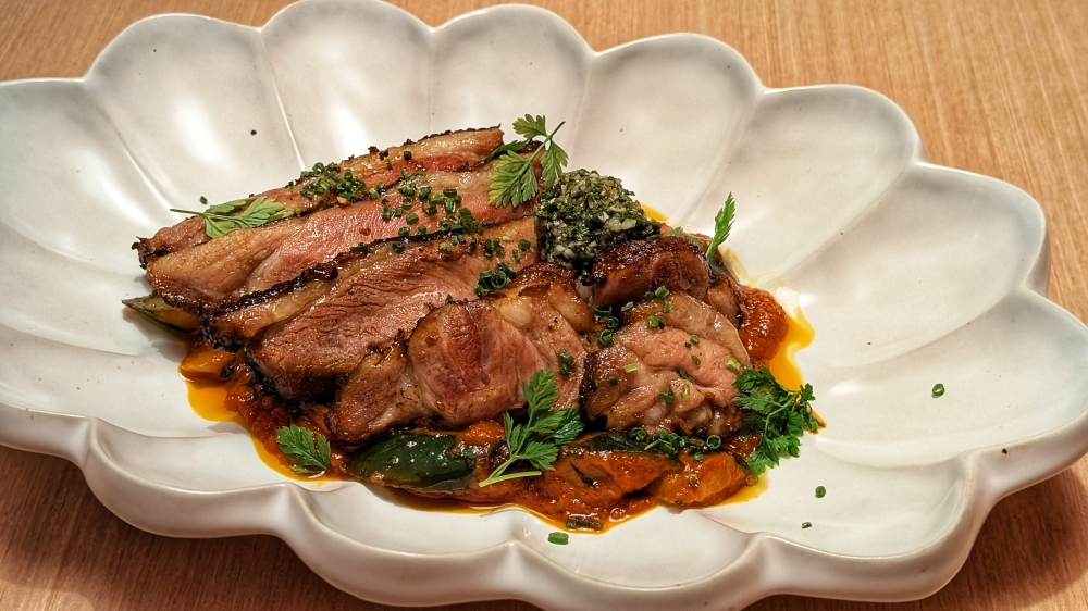 Herb-roasted lamb shoulder is one of the highlight main plates. — Picture by Ethan Lau