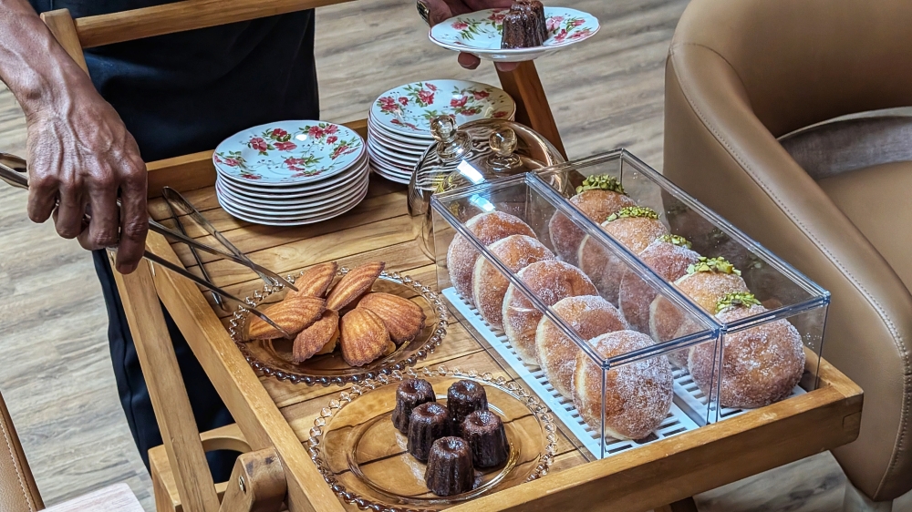 A trolley in a restaurant always gets people excited; even more so when it comes bearing madeleines, canelés and donuts. — Picture by Ethan Lau