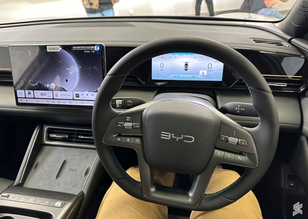 Inside, a minimalist cabin pairs soft-touch materials with a panoramic sunroof for a premium EV vibe. — SoyaCincau pic