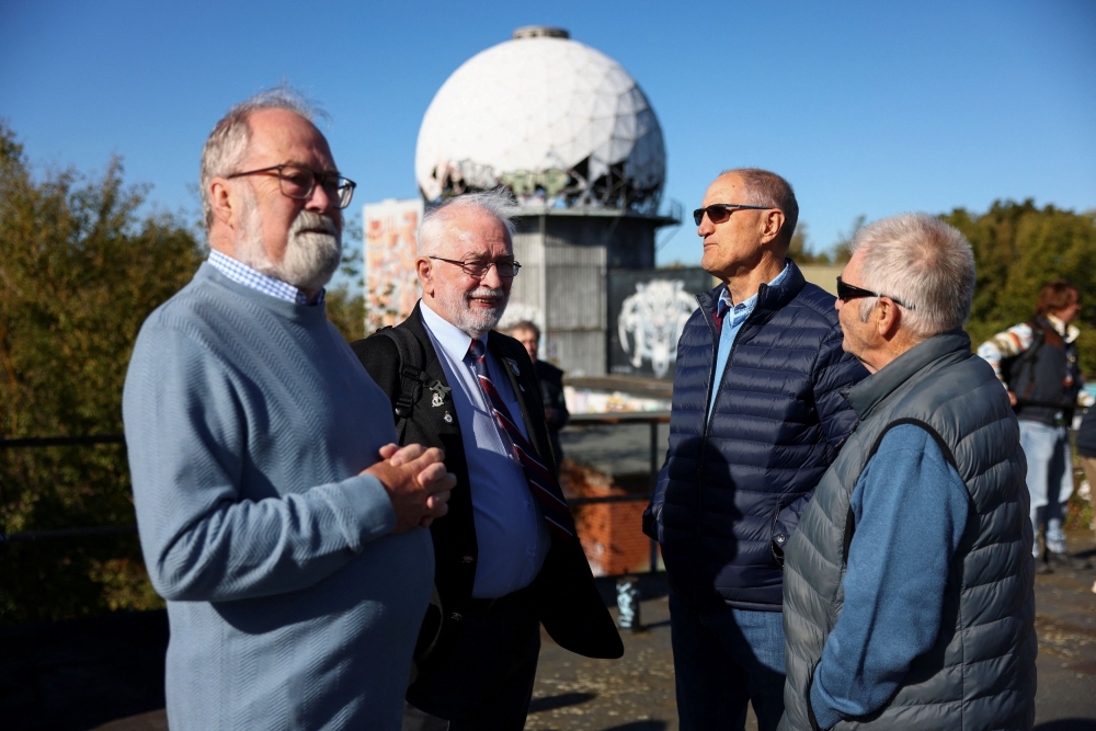 Mike, Brian, Ken and Ian talk, as a group of former British conscripts, once stationed at the Teufelsberg US listening and radar station, return to their former post to reminisce about their work in the divided city during the Cold War, in Berlin, Germany September 24, 2025. — Reuters pic