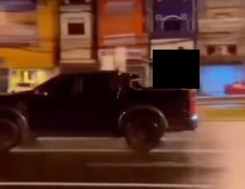 Screengrab from the 15-second video showing Georgii and a 42-year-old Thai woman, both naked, having sex at the back of a moving black pickup truck on a Phuket road.
