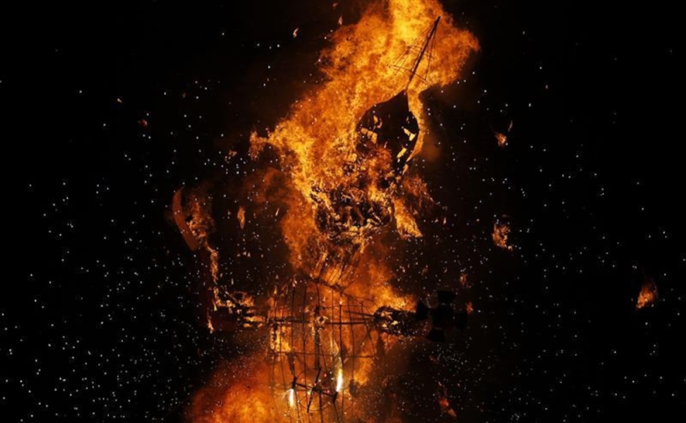 An effigy of 10-headed demon King Ravana collapses after it is burnt during the Hindu festival of Dussehra in Srinagar, India on October 6, 2011. — Reuters pic