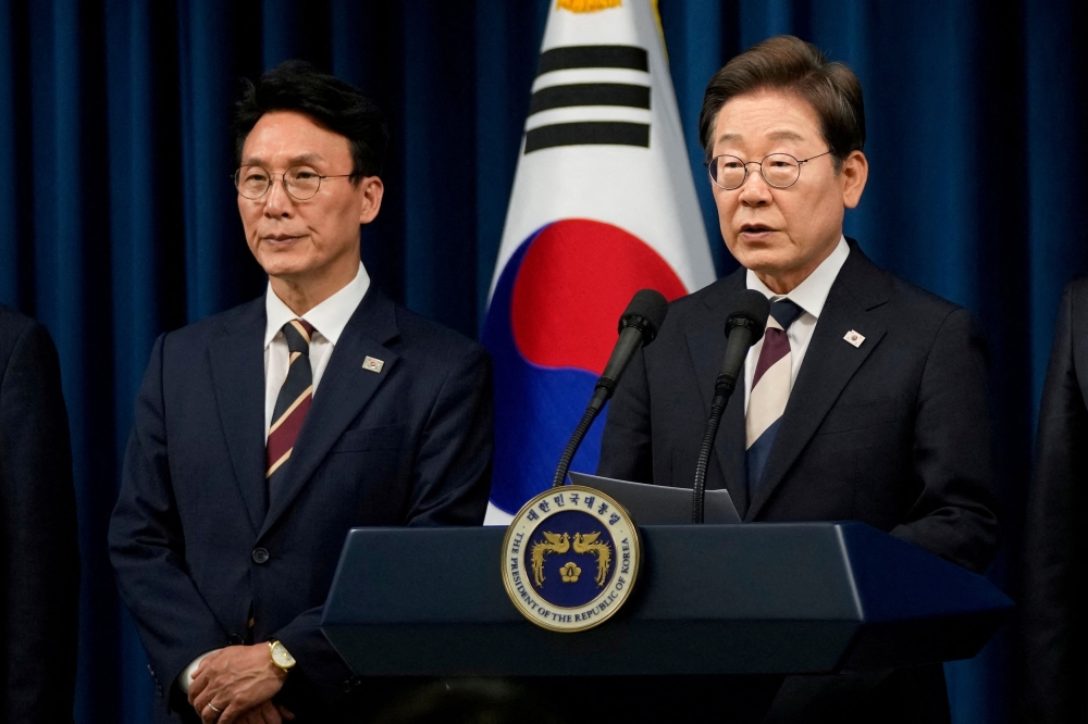 South Korean President Lee Jae-myung speaks during a press conference with Kim Min-seok (left), appointed as Prime Minister, at the Presidential office in Seoul June 4, 2025. Kim apologised today for the inconvenience to the public from disrupted services and said the government would work swiftly to restore services. — Ahn Young-joon/Pool/Reuters pic