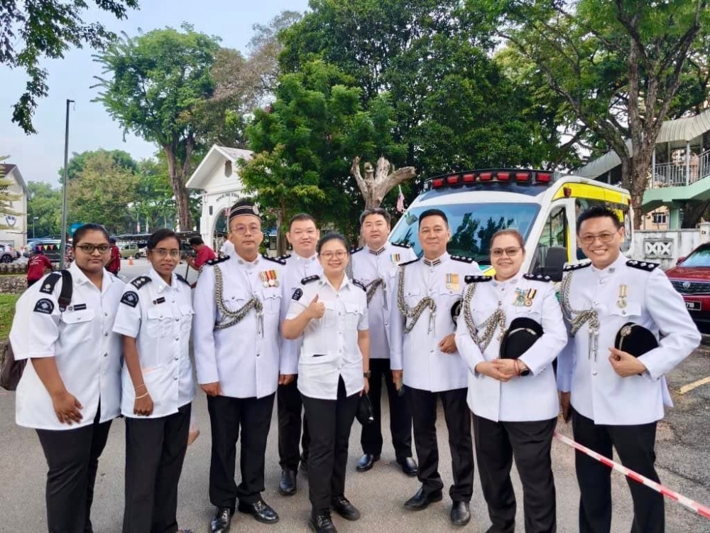 Members of St John Ambulance of Malaysia (SJAM) Penang pose for photographs ahead of  its annual parade on Sept 27, 2025. — St John Ambulance of Malaysia AK Academy Corps pic
