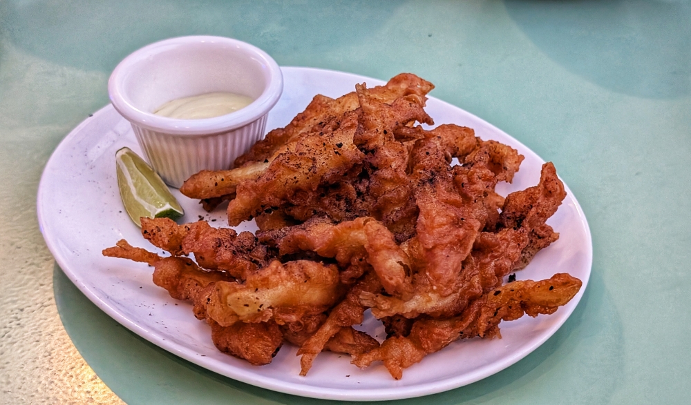 ‘Pez fritos’, battered and fried whitebait, make for a great snack. — Picture by Ethan Lau