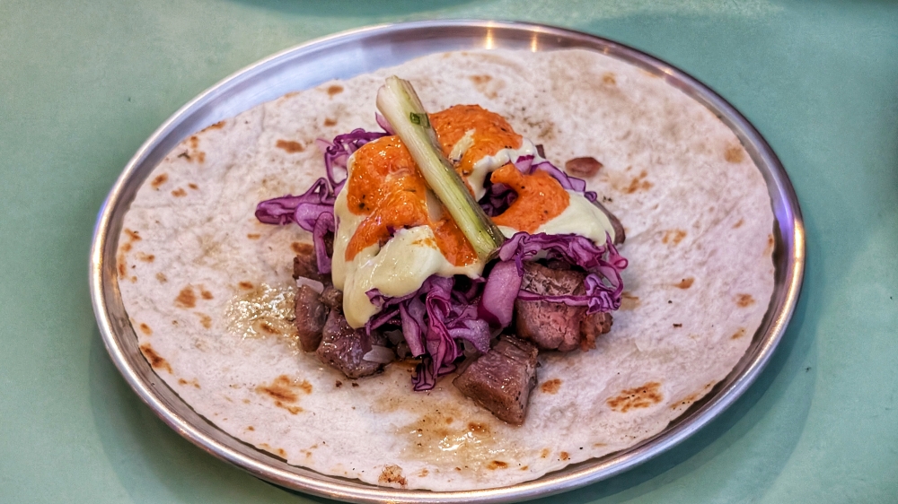 The ‘carne asada taco’ in Sonora style is a standout, featuring beef brisket with a punchy pimento ‘salsa’. — Picture by Ethan Lau
