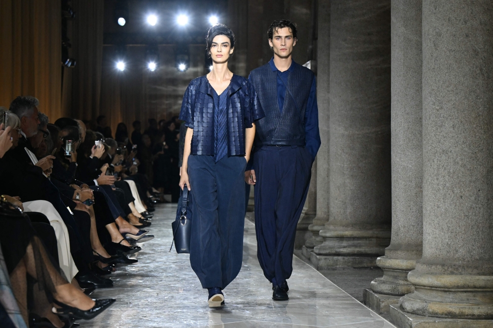 Models walk the runway during the Giorgio Armani collection show. — AFP pic 