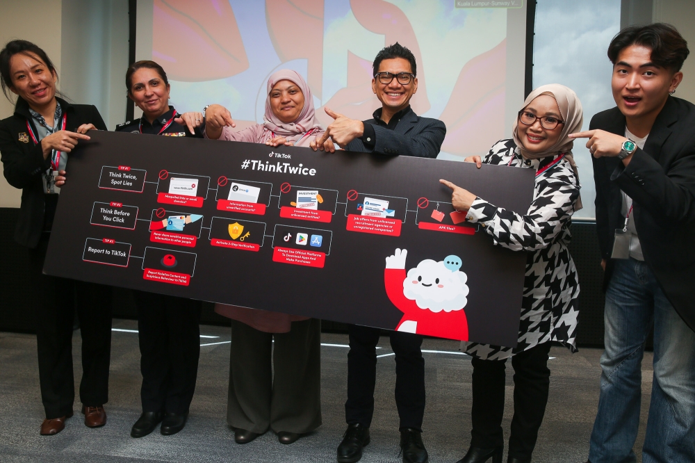(From left) National Anti-Financial Crime Centre’s (NFCC) Chian Wen Sin, Bukit Aman Commercial Crime Investigation Department’s (CCID) Supt Rajvinder Kaur, MCMC Head of Community Engagement Department Saidatul Ashikin Abu Hassan, TikTok Malaysia public policy head Firdaus Fadzil, TikTok content creators Wan Fatin Sufina and Kee Sen Yao pose for a picture at TikTok’s #ThinkTwice media briefing on scam prevention in Kuala Lumpur September 29, 2025. — Picture by Choo Choy May