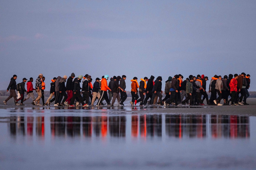 In a major policy shift, interior minister Shabana Mahmood was to tell the Labour conference that migrants would have to make social security contributions, claim no benefits, have a clean criminal record and volunteer in their community in order to stay. — AFP pic