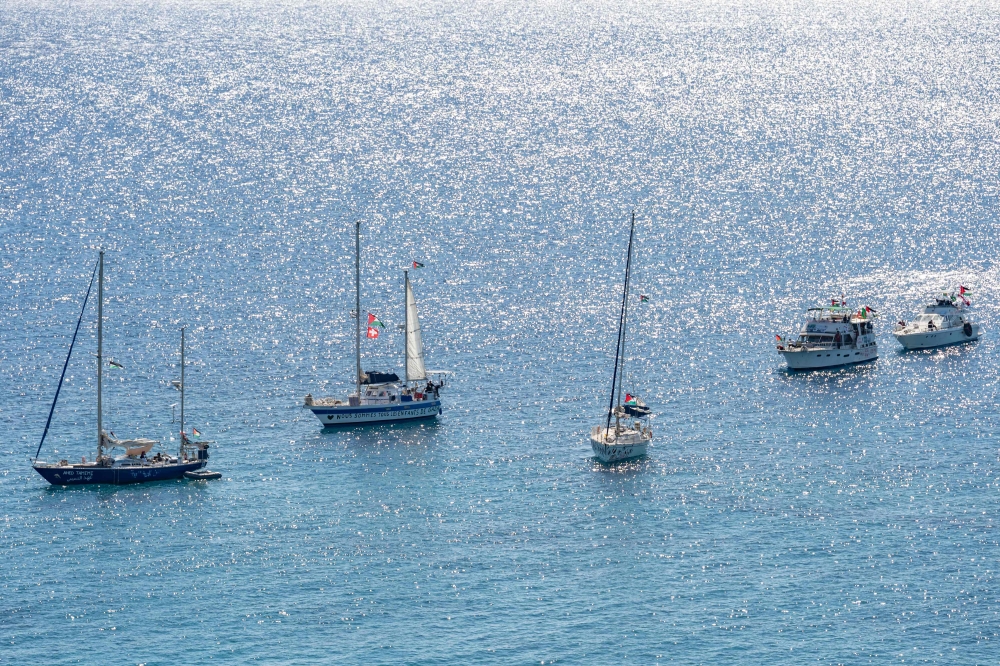 A group of ships of the Global Sumud Flotilla to Gaza are shown moored at the small island of Koufonisi, south of the island of Crete on September 26, 2025.  — AFP pic 