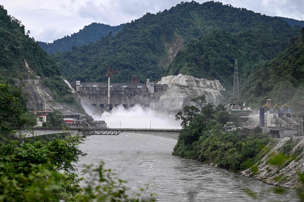 This photograph taken on August 23, 2025 shows a general view of the newly constructed Subansiri Lower Hydroelectric Project (SLHEP) on the Subansiri River, at the border of the northeastern states of Assam and Arunachal Pradesh. — AFP pic 