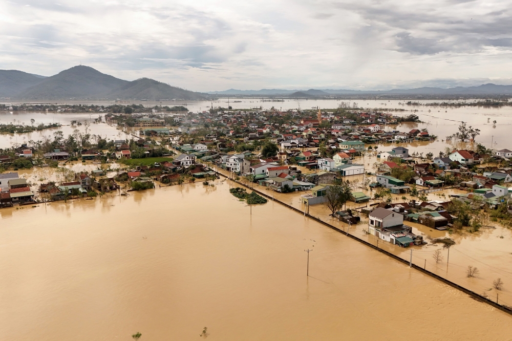 An aerial photo shows flood waters surrounding homes after typhoon Bualoi passed over Lam Thanh commune in Nghe An province on September 30, 2025. A severe storm that ripped roofs off homes has killed dozens of people across Vietnam and the Philippines, officials from both countries said on September 29, as weakened Bualoi crossed into neighbouring Laos. — AFP pic