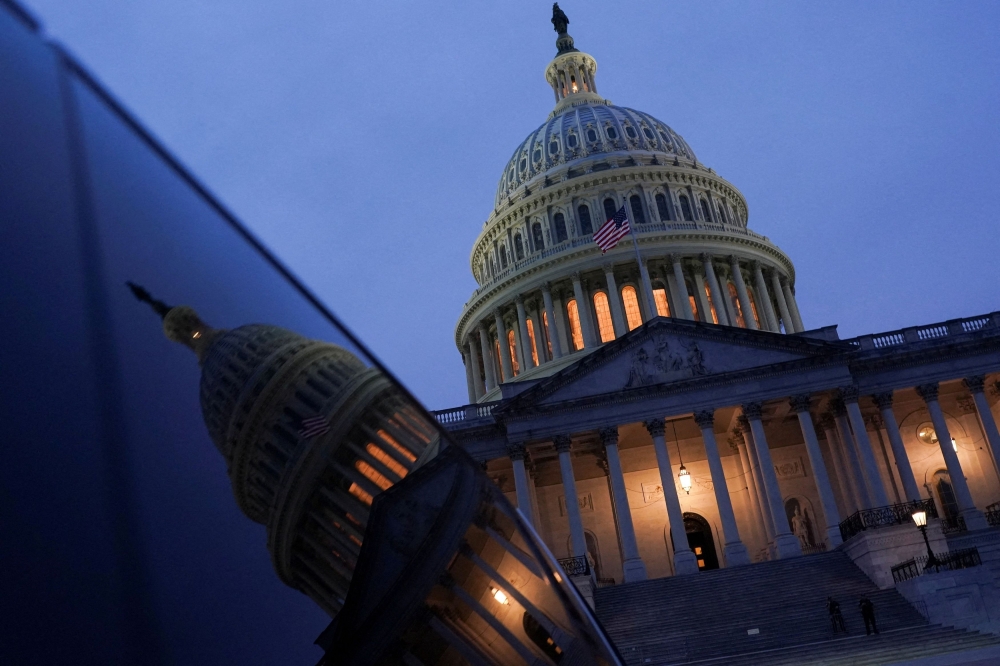 The sun sets behind the US Capitol dome, on the day US President Donald Trump met with top congressional leaders from both parties, just ahead of a September 30 deadline to fund the government and avoid a shutdown, in Washington, D.C. September 29, 2025. — Reuters pic 