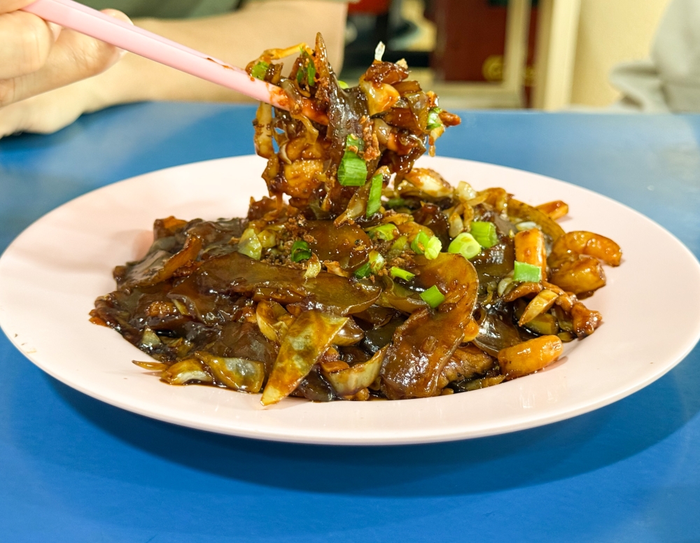 Rarely seen outside of Hokkien homes, this fried sweet potato noodles with its slightly chewy texture, makes you keep coming back for it. — Picture by Lee Khang Yi