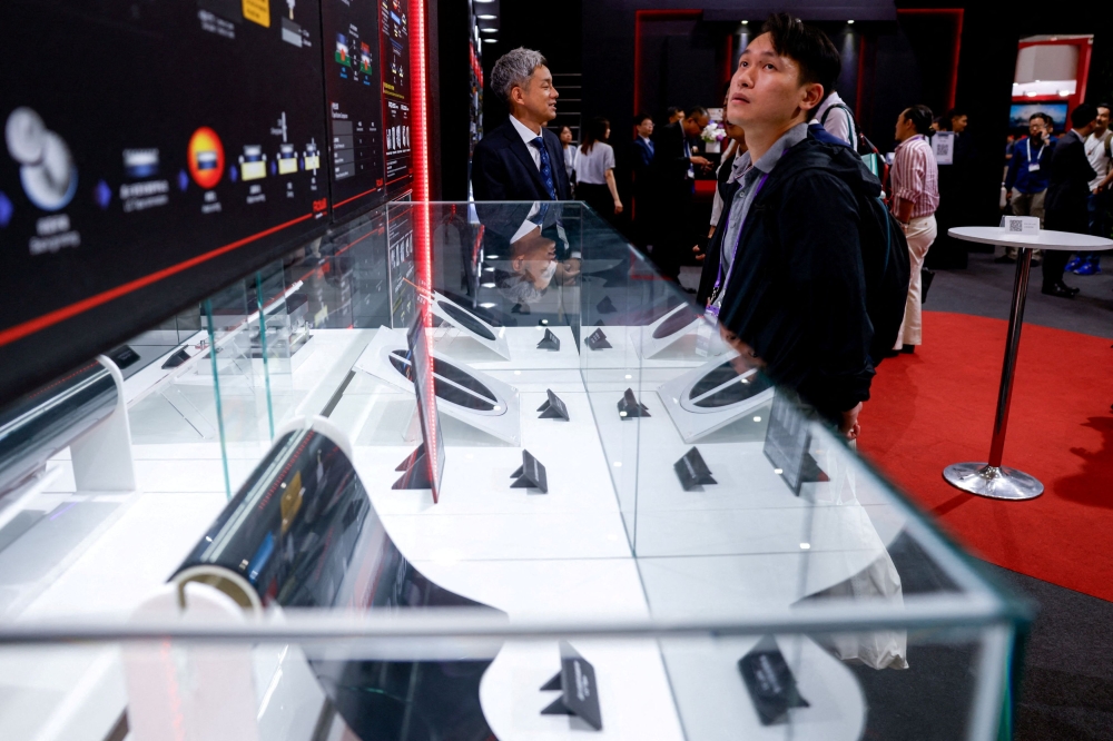 A visitors looks at semiconductor products on display at SEMICON 2025 in Taipei, Taiwan, September 10, 2025. — Reuters pic