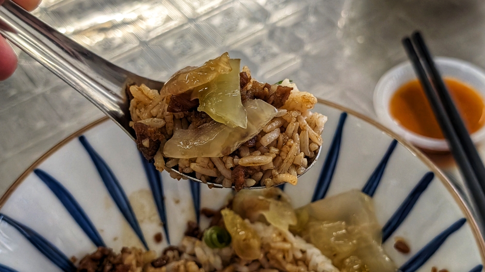 Each spoonful of rice and pork is well balanced with salted vegetables. — Picture by Ethan Lau