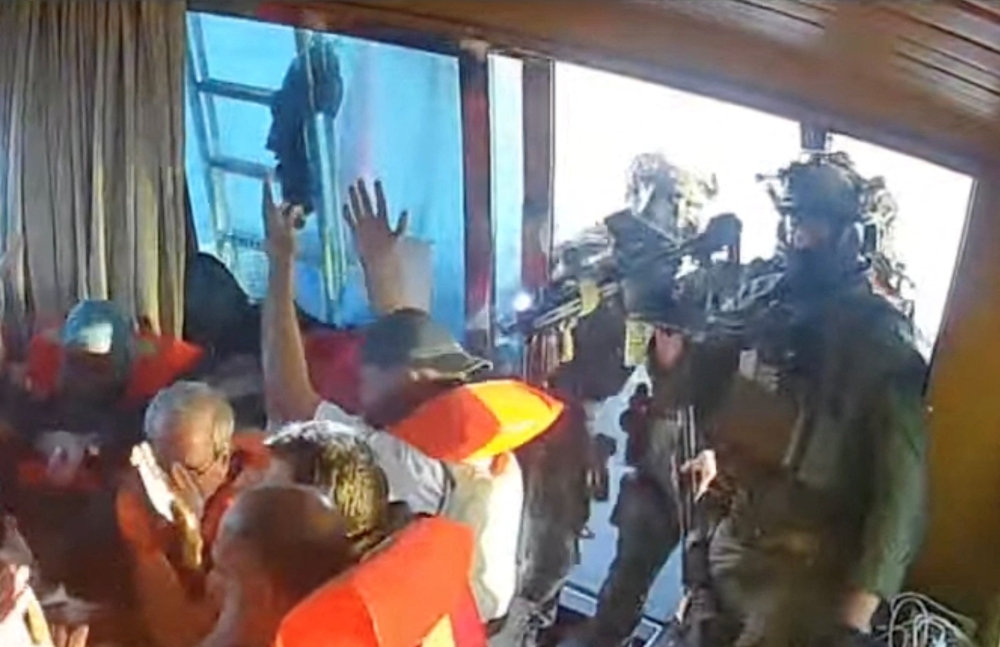 A screengrab from a live stream video shows Israeli navy forces aboard the Gaza-bound vessel Florida, part of the Global Sumud Flotilla, which flotilla organisers report has been intercepted, October 2, 2025. — Global Sumud Flotilla handout pic via Reuters 