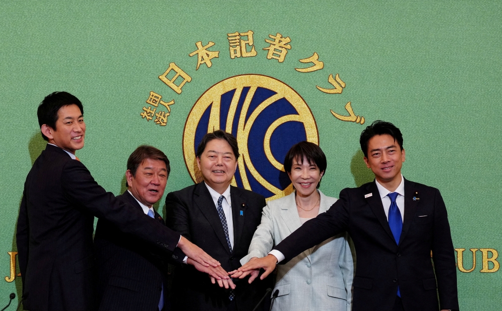 (L-R): Former Economic Security Minister Takayuki Kobayashi, former LDP Secretary-General Toshimitsu Motegi, Chief Cabinet Secretary Yoshimasa Hayashi, former Economic Security Minister Sanae Takaichi and Agriculture Minister Shinjiro Koizumi pose for group photos before the Liberal Democratic Party (LDP) presidential election candidate debate at Japan National Press Club in Tokyo, Japan, on Sept 24, 2025. — Reuters pic