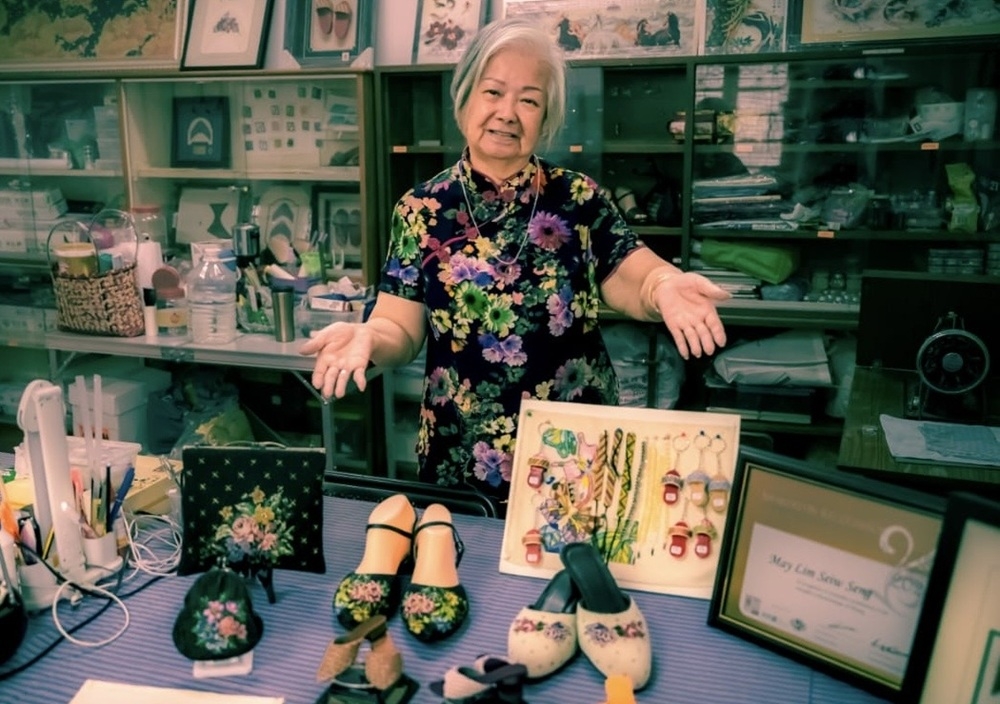 May Lim poses with ‘manik’ shoes and other beaded pieces. — Picture courtesy of May Lim