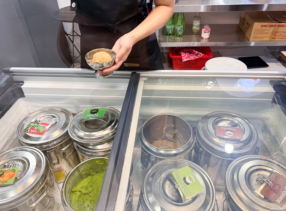 The ice cream is stored in stainless steel containers to ensure its freshness. — Picture by Lee Khang Yi