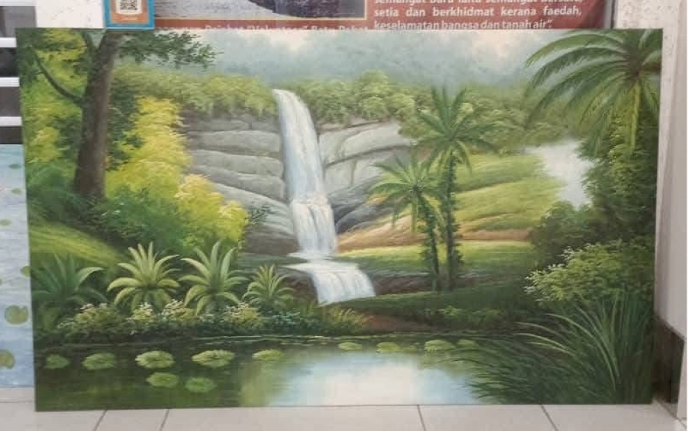 One of two stolen paintings depicting the popular Kota Tinggi Waterfall area and its surrounding flora is shown on October 3, 2025. — Picture courtesy of Nur Farhana Zakaria’s Facebook