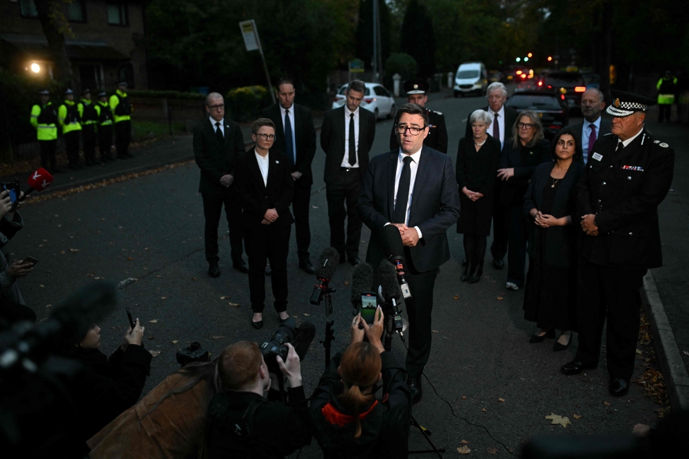 Mayor of Greater Manchester, Andy Burnham speaks to members of the media near to Heaton Park Hebrew Congregation synagogue in Crumpsall, north Manchester. — AFP pic