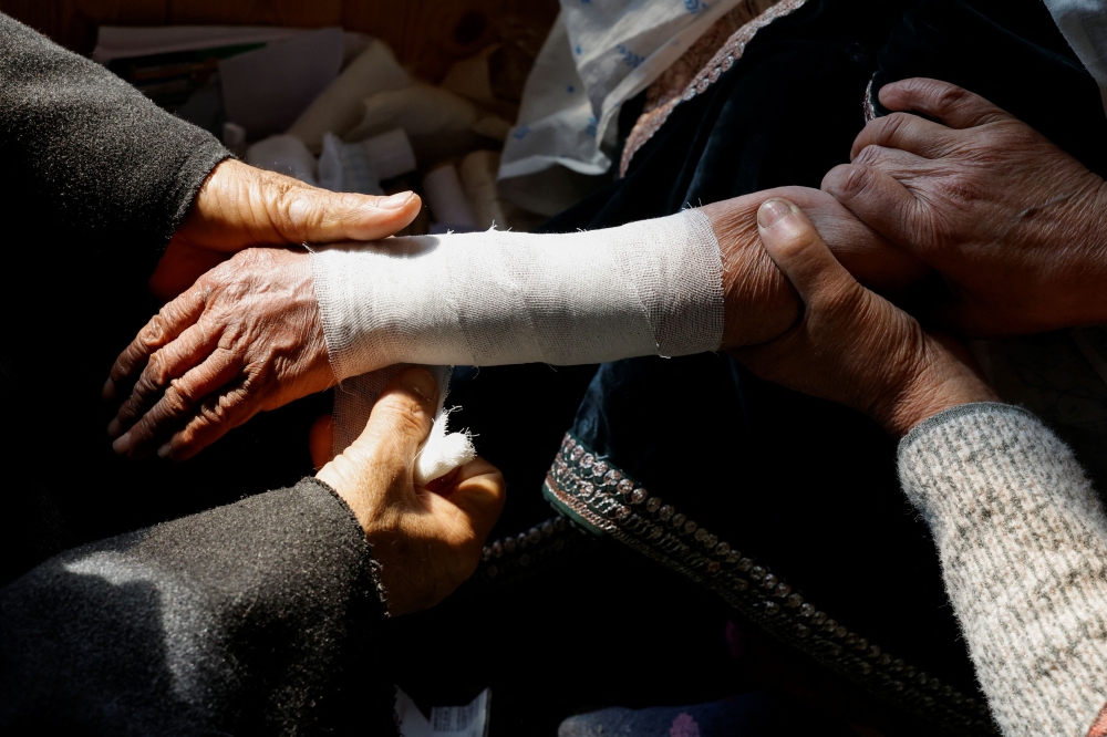 Many patients believe bonesetters possess a spiritual, healing touch and are more effective than modern medicine, although mainstream medical experts say it can be risky and has limitations. — Reuters pic