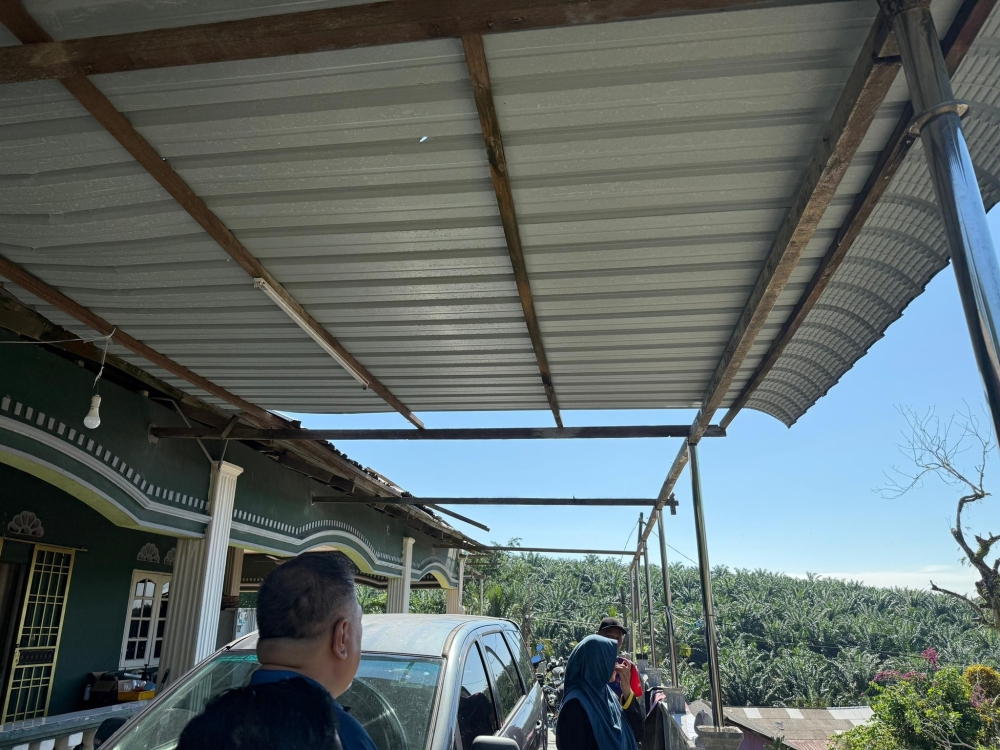 Several houses in Johor were missing zinc roofing sheets following a severe storm that ripped through the state on October 2, 2025. — Picture from Facebook/Mohd Jafni Md Shukor