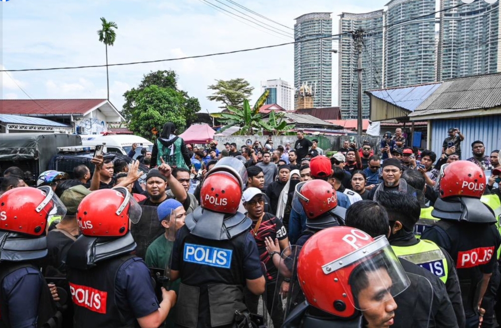 A court-ordered eviction at Kampung Sungai Baru in Kuala Lumpur resulted in a violent protest that led to the Dang Wangi police chief being struck with a stone on September 11, 2025. — Picture from Facebook/Anwar Ibrahim