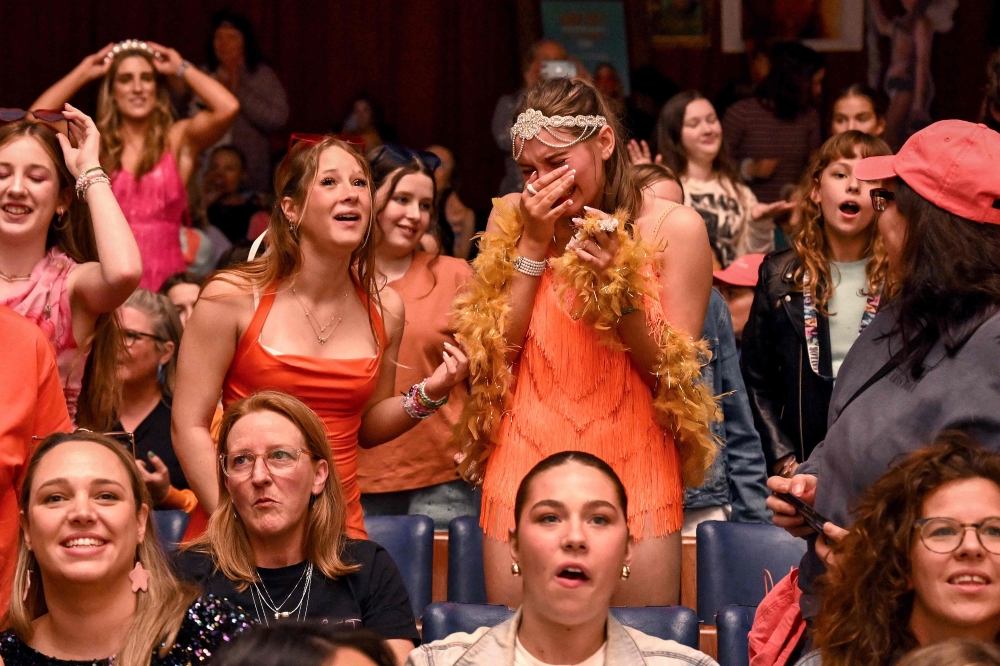 Taylor Swift fans dance during a listening event for Swift’s new album ‘The Life of a Showgirl’ at the Astor Theatre in Melbourne October 3, 2025. — AFP pic 