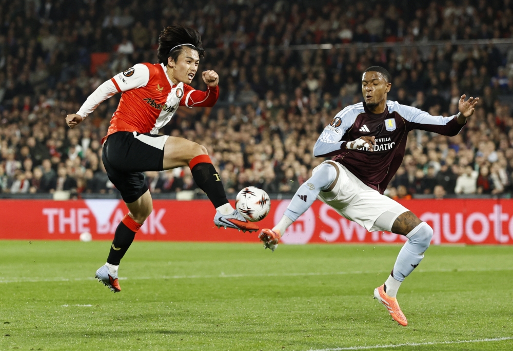 Feyenoord’s Ayase Ueda in action with Aston Villa’s Ezri Konsa at Feyenoord Stadium, Rotterdam, Netherlands, October 2, 2025. — Reuters pic 