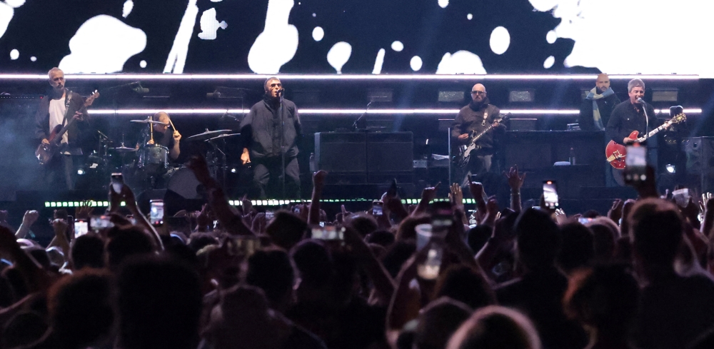 Paul ‘Bonehead’ Arthurs (right) performs with the band during their Oasis Live ‘25 Tour at the Rose Bowl Stadium in Pasadena, California, September 6, 2025. — Reuters pic