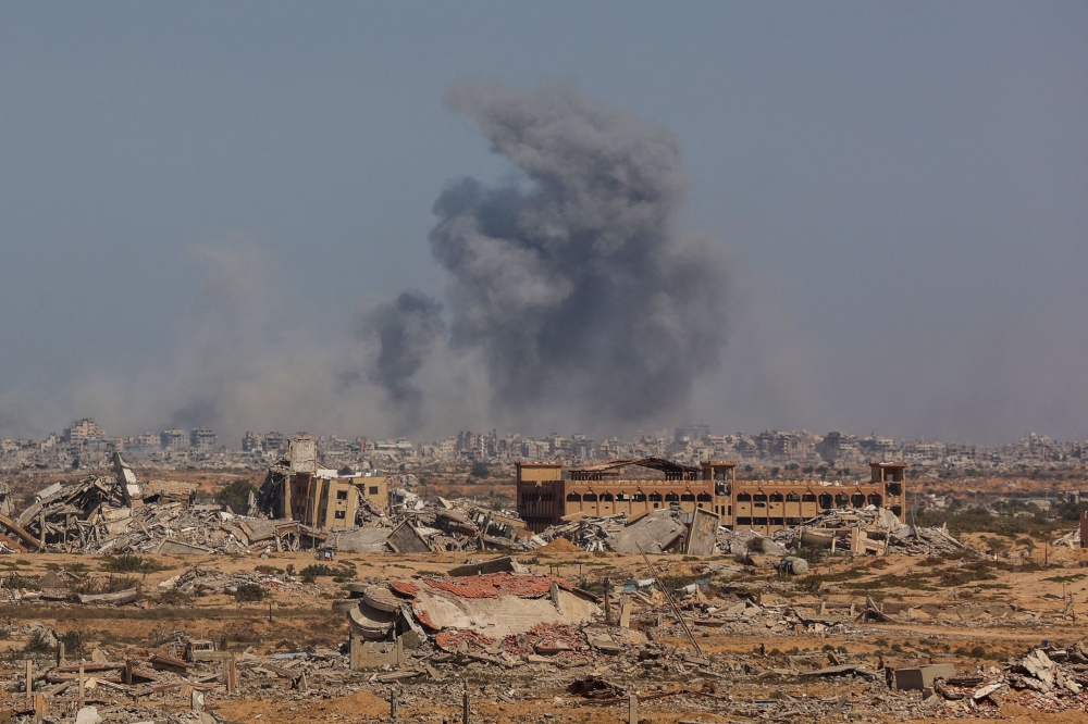 Smoke rises after an Israeli strike in Gaza City, October 2, 2025, as seen from Nuseirat in central Gaza amid the ongoing conflict with Hamas. — AFP pic