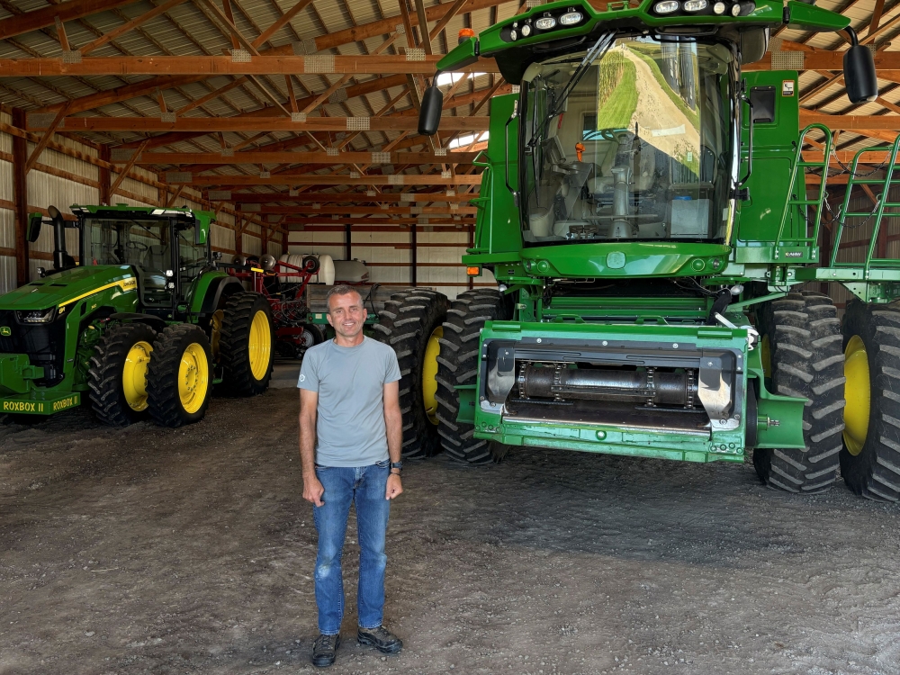 Soybean grower Ryan Frieders poses for a photo next to machinery on his farm in Waterman, Illinois August 27, 2025. — Reuters pic