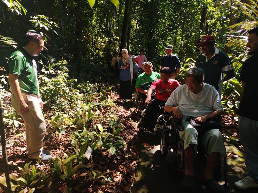 Wheelchair users were given a tour of FRIM during its 40th anniversary open day. — Picture from Facebook/FRIM
