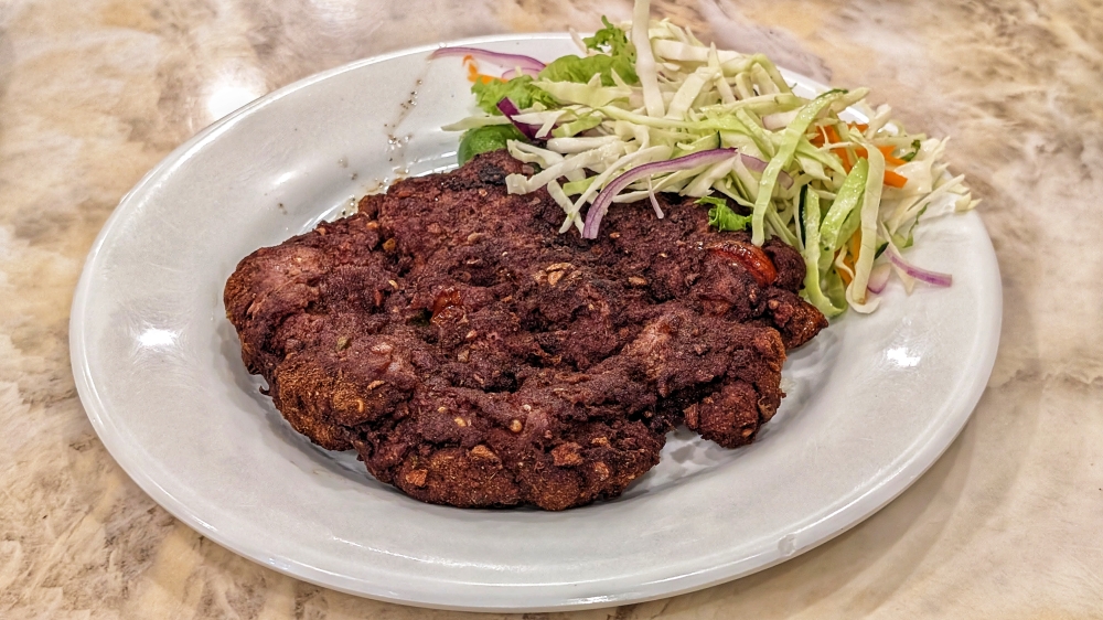 ‘Chapli kebab’ is another Pakistani staple that has Pashtun origins. — Picture by Ethan Lau