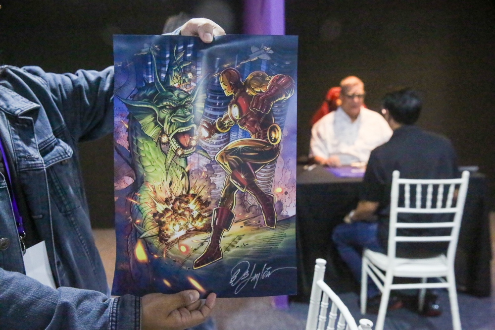 A copy of the artwork by Ruby Ling, Emily Yim and Bob Layton, signed by Layton. — Picture by Choo Choy May