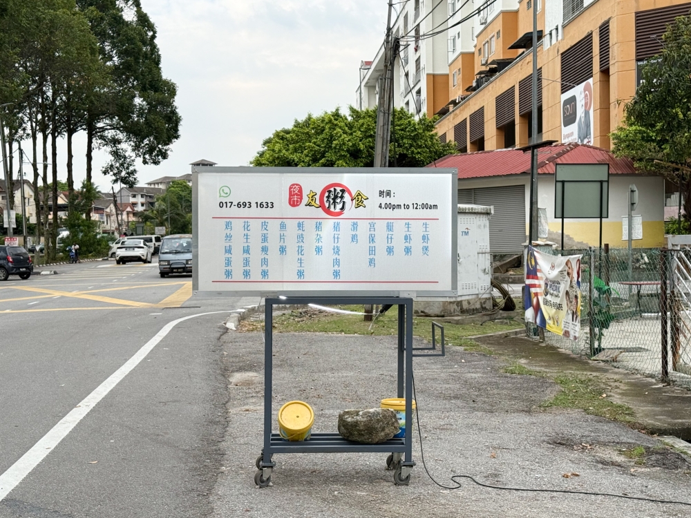 There's no big signboard except this moving signage outside the restaurant. — Picture by Lee Khang Yi