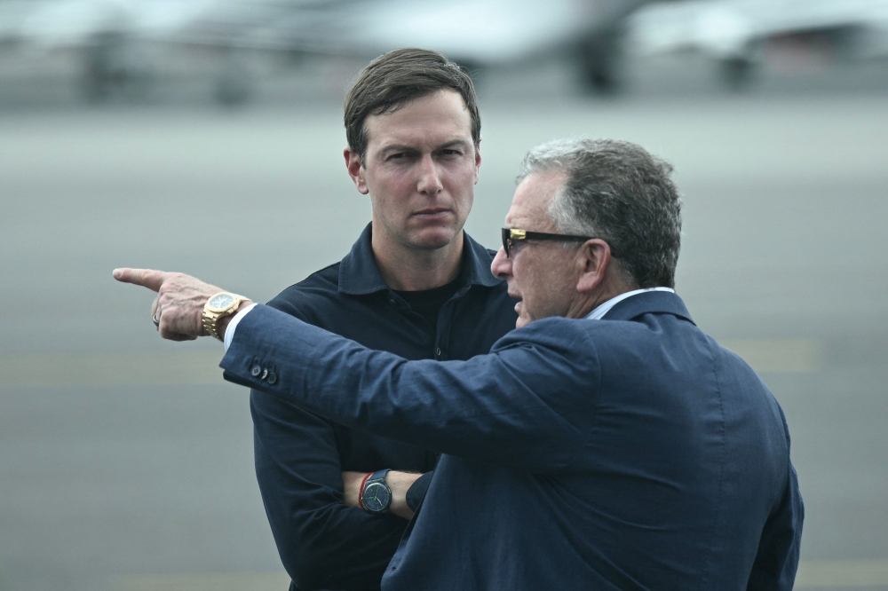 US special envoy to the Middle East Steve Witkoff (R) and Jared Kushner await the arrival of President Donald Trump and First Lady Melania Trump at Teterboro Airport in Teterboro, New Jersey, on July 13, 2025. — AFP pic