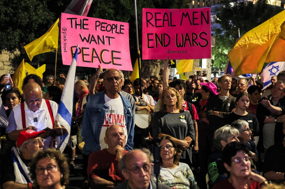 Protesters gather during an anti-government protest organised by the  families of the Israeli hostages taken captive in the Gaza Strip since October 2023, outside the Israeli Prime Minister's residence in Jerusalem on October 4, 2025. — AFP pic