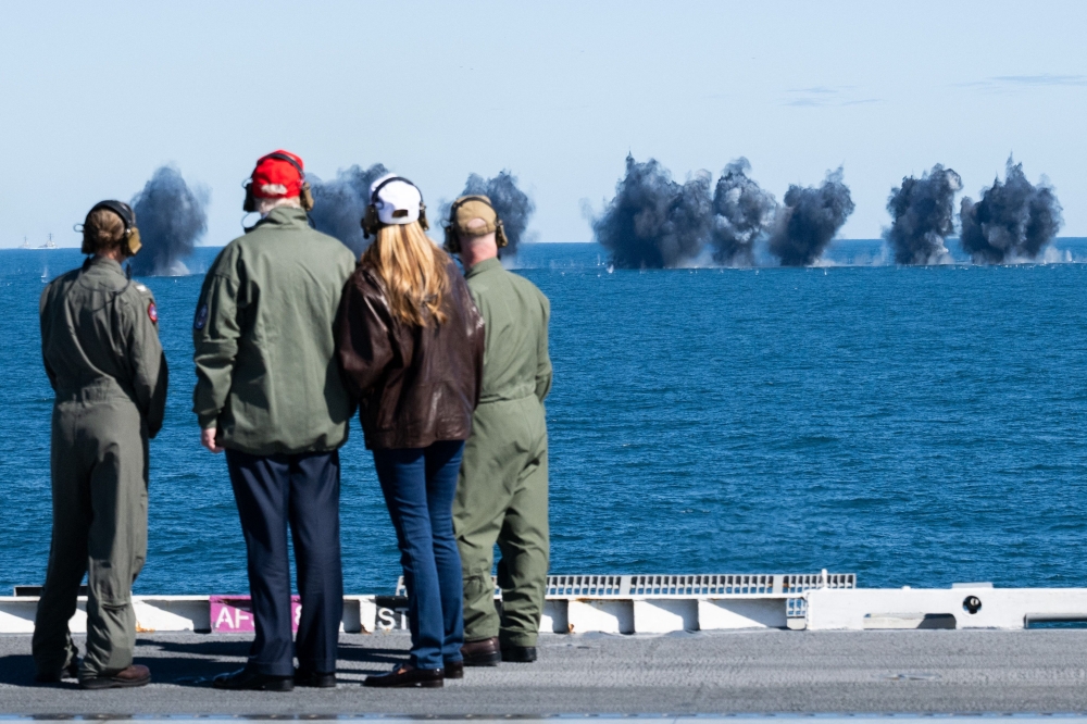 US President Donald Trump (2nd left) and First Lady Melania Trump (2nd right) watch a naval demonstration during a visit to the USS George H.W. Bush aircraft carrier which is out at sea near Norfolk, Virginia, October 5, 2025, as part of the US Navy’s 250th anniversary celebration, ‘America’s Navy 250: Titans of the Sea — A Salute to the Fleet’. — AFP pic