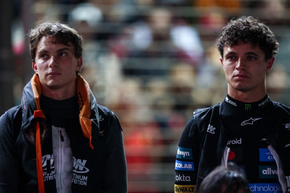 McLaren F1 Team’s Oscar Piastri (AUS) and Lando Norris (GBR) are seen during the 2025 Formula 1 Singapore Grand Prix at the Marina Bay Street Circuit, Singapore. — Eric Alonso/DPPI pic via AFP