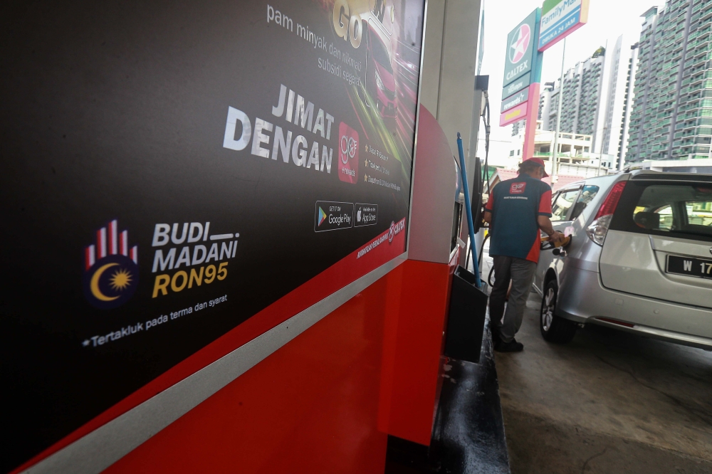 An attendant refuels a vehicle at a Caltex petrol station in Kuala Lumpur September 30, 2025. — Picture by Sayuti Zainudin
