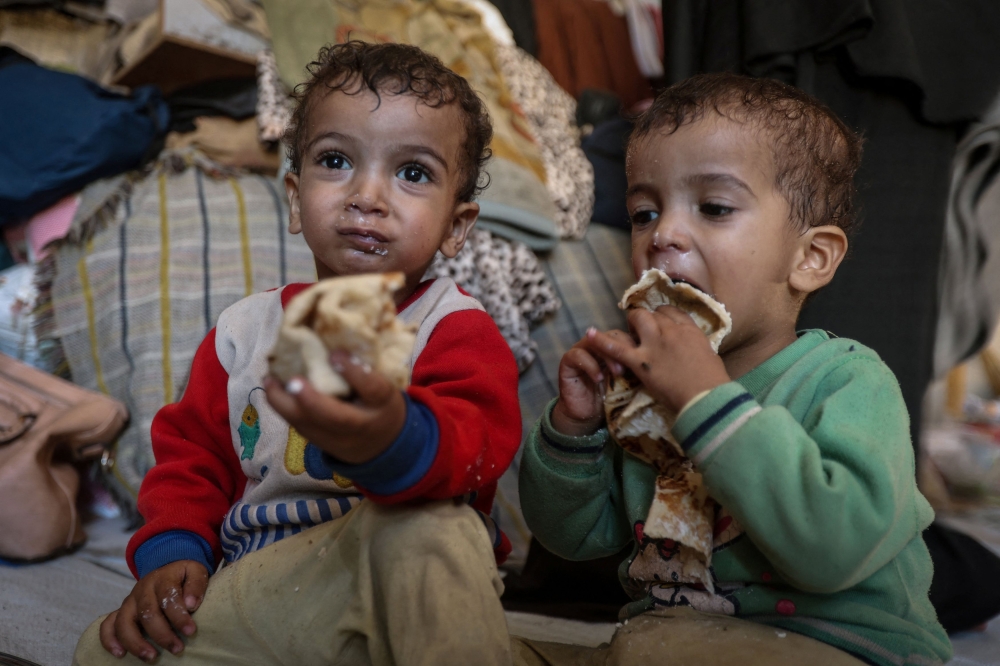 Palestinian twins Uday and Hamza Abu Odah have known nothing but war since they were born in Gaza, less than a month after the conflict began on October 7, 2023. — Reuters pic